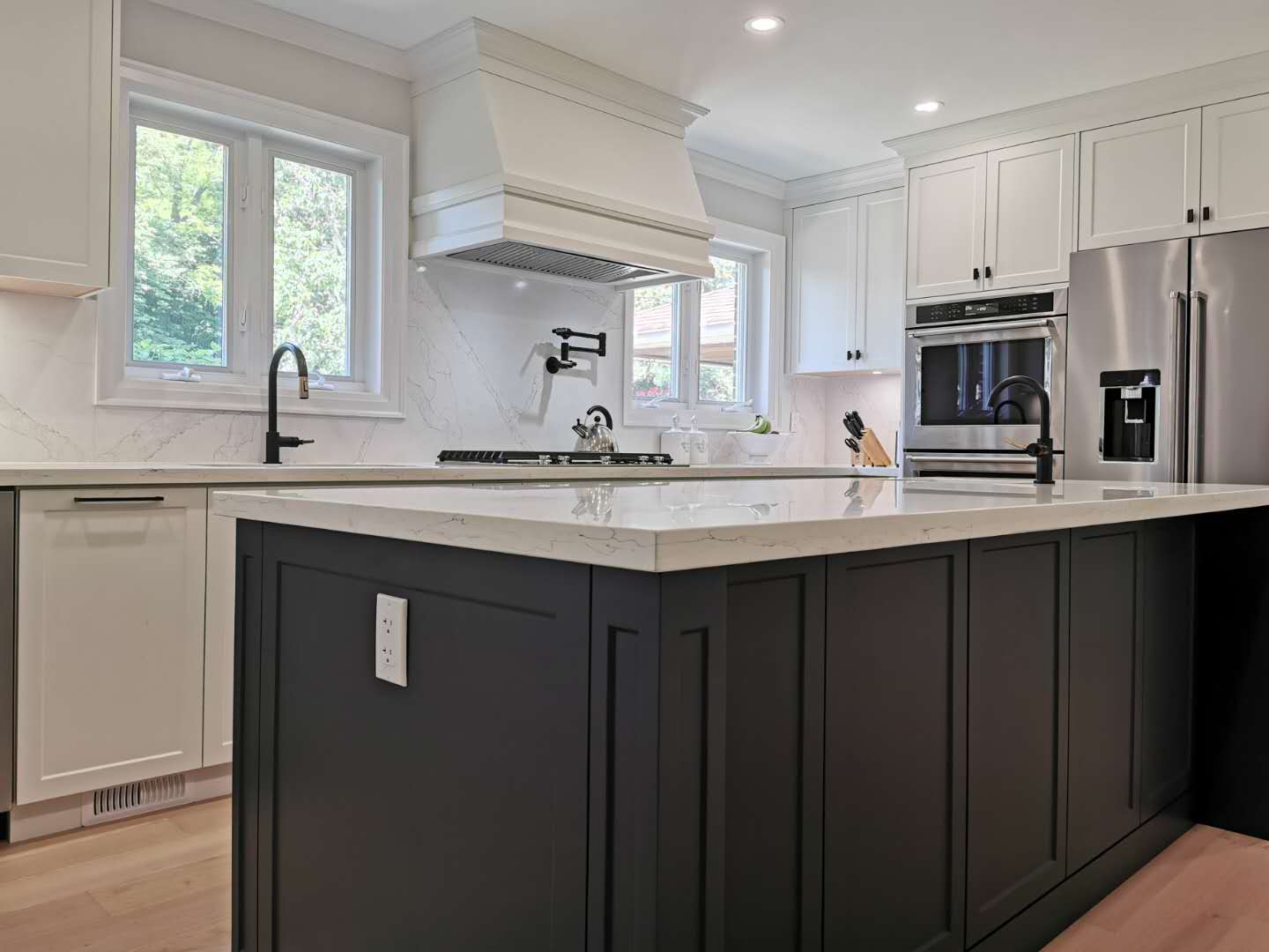 Modern Kitchen Featuring Duo Color Contrast Central Island and Flush Appliance Design