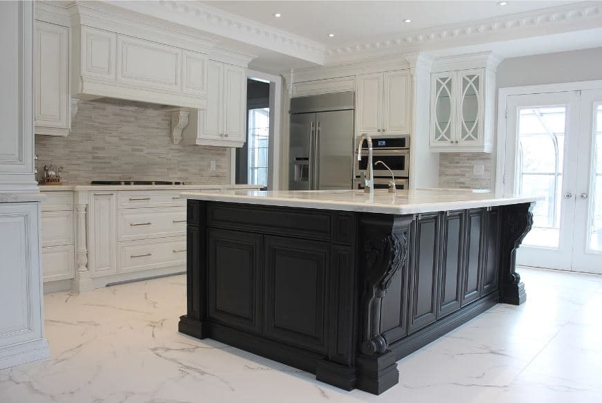 Traditional Kitchen Featuring White Cabinetry and Black Island With Manhattan Raised Profile Door Style