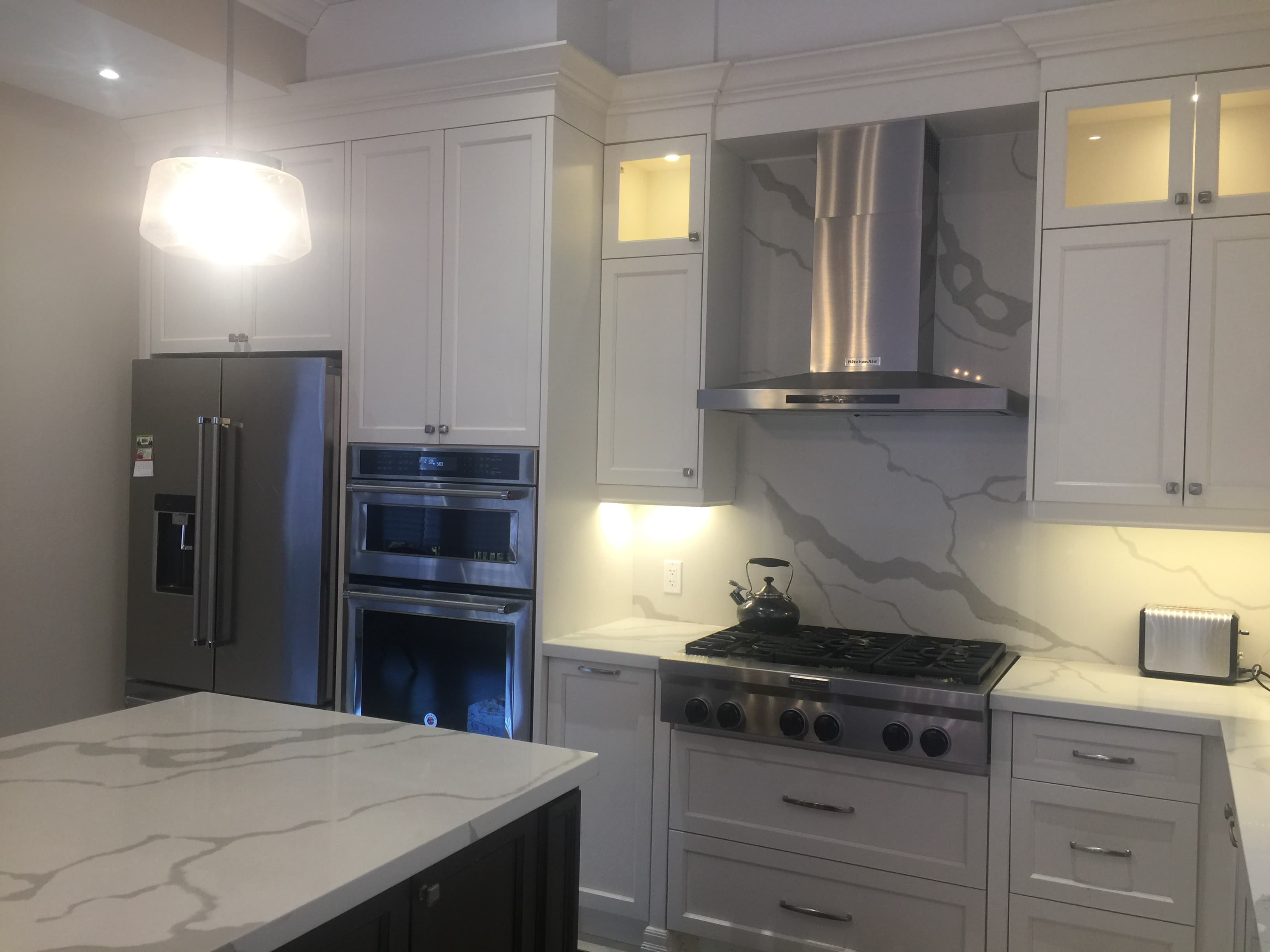Transitional Kitchen - L Shape Design, Drop Down Hood Design, and In Cabinet Pot Light