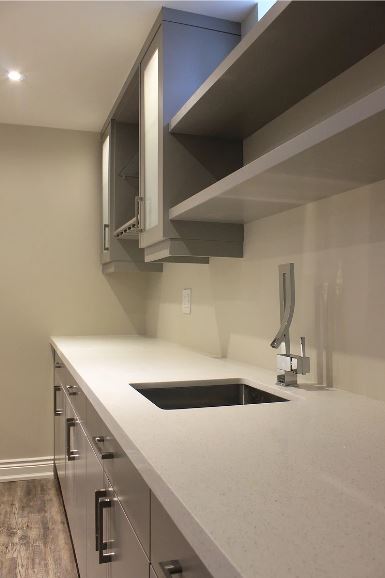 painted MDF cabinets with white quartz