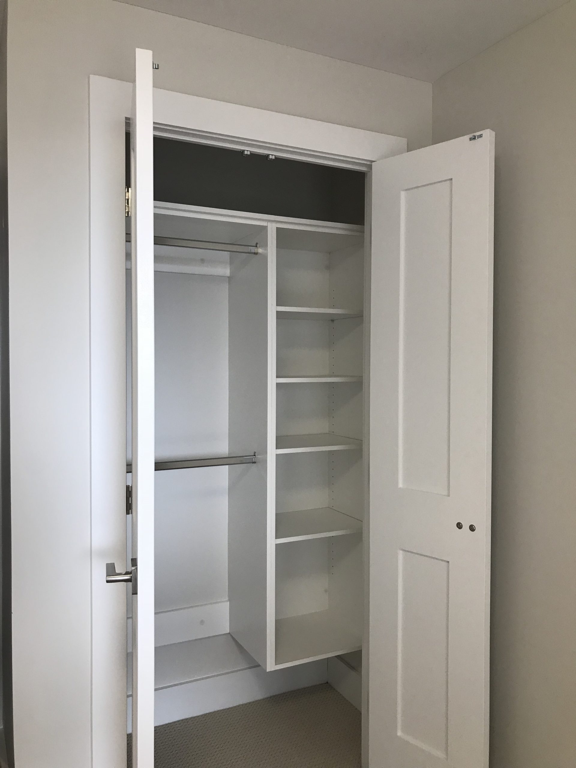 Custom Built Closet with Open Door Storage Cabinet and Duo Level Coat Rack