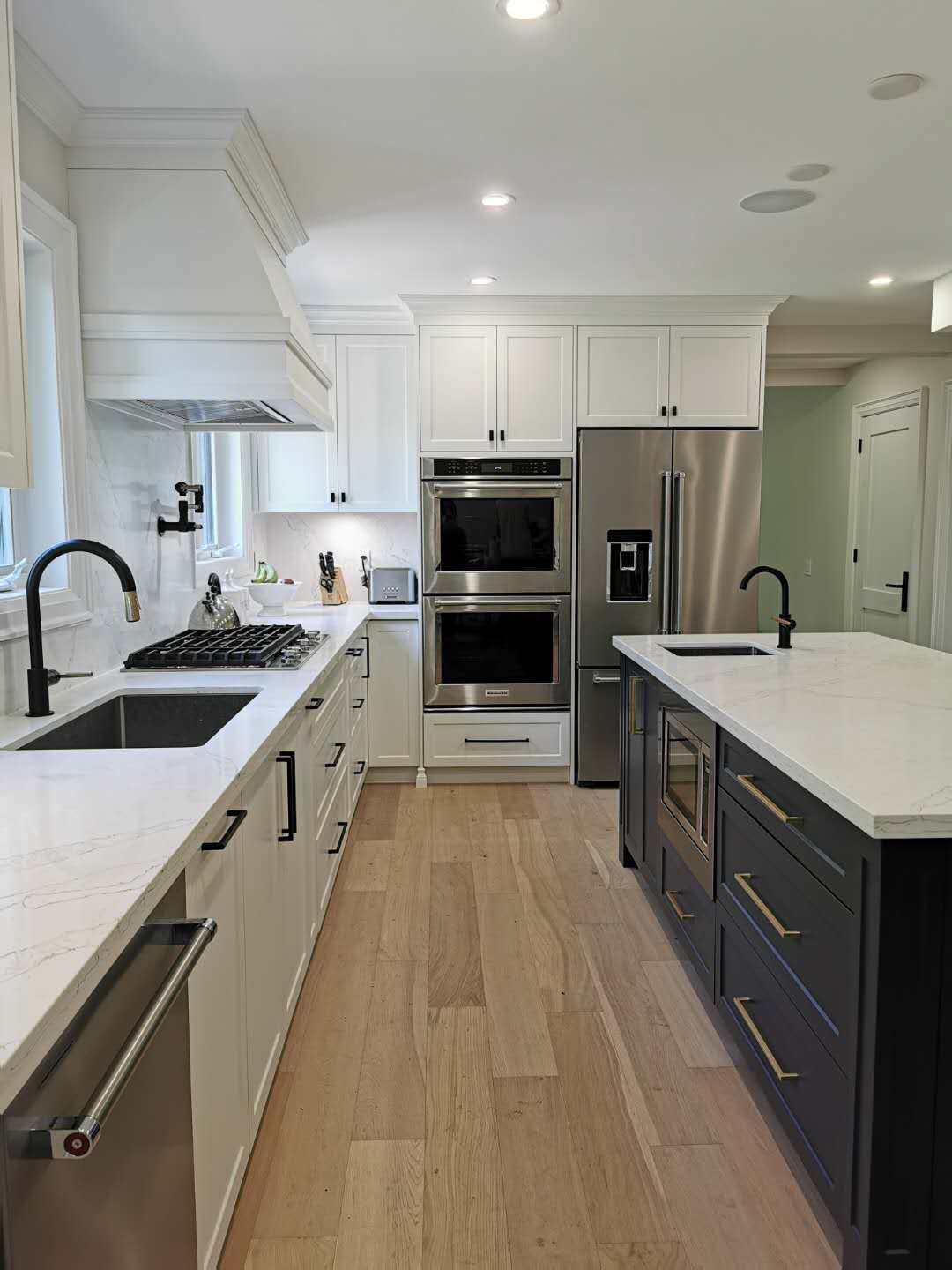 Modern Kitchen Featuring Duo Color Contrast Central Island and FLush